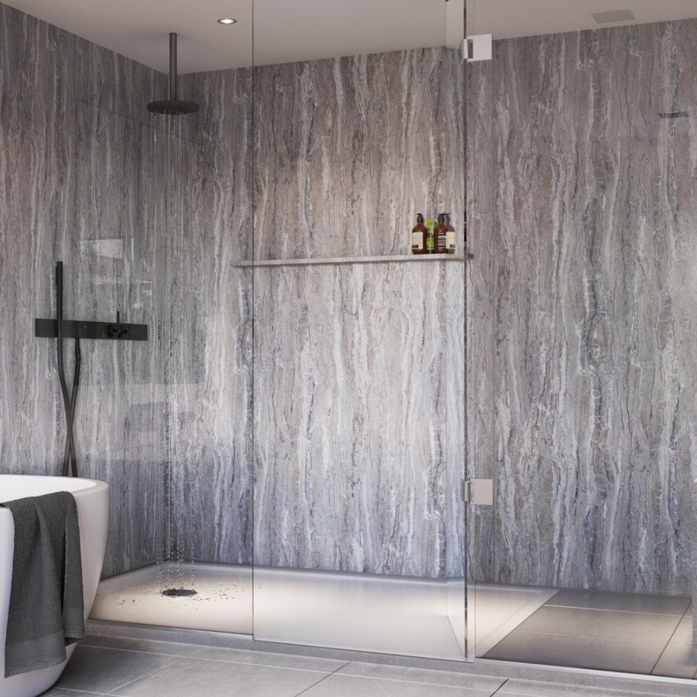 Lifestyle image of the Showerwall Laminate Blue Tone Stone 2440mm x 879mm Proclick MDF Wall Panel - SW55 in a large open-ended walk in shower enclosure with overhead shower
